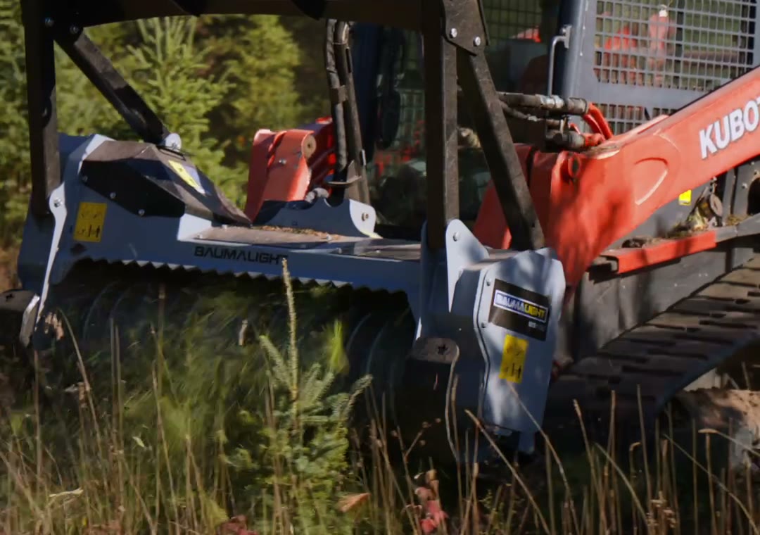Baumalight drum mulching head on RYNO's Kubota track loader in tall grass